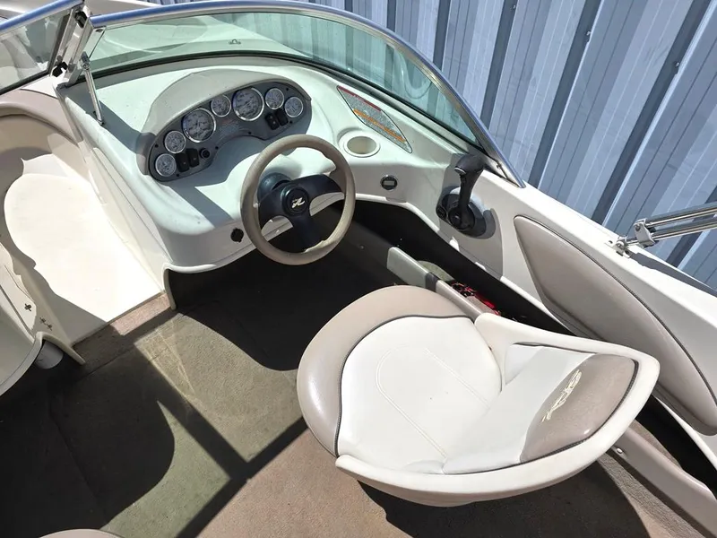 Slide: The Image of 2003 Sea Ray 176 SRX BR boat interior with steering wheel and dashboard. - 3