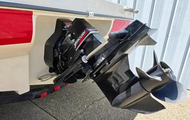 Slide: The Image of 2003 Sea Ray 176 SRX BR boat with Mercury outboard motor, close-up view. - 8