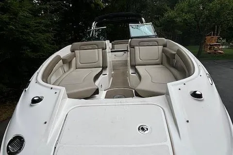 Slide: The Image of 2012 Sea Ray 260 Sundeck boat with spacious seating and sleek design. - 11