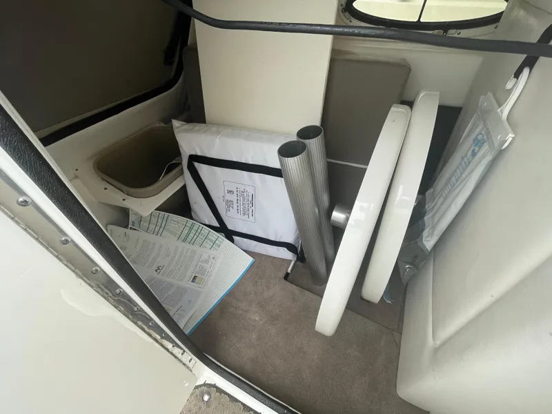 Slide: The Image of Interior storage area of a 2012 Sea Ray 260 Sundeck boat with various items. - 19