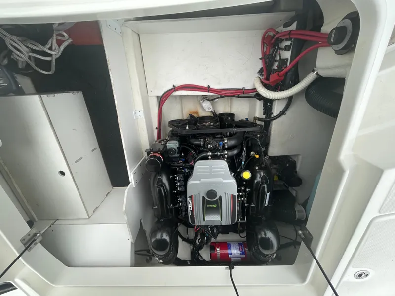 Slide: The Image of Engine compartment of a 2012 Sea Ray 260 Sundeck with visible wiring and components. - 23