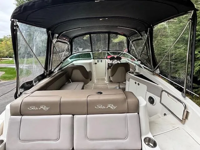 Slide: The Image of 2012 Sea Ray 260 Sundeck boat interior with canopy and seating. - 5