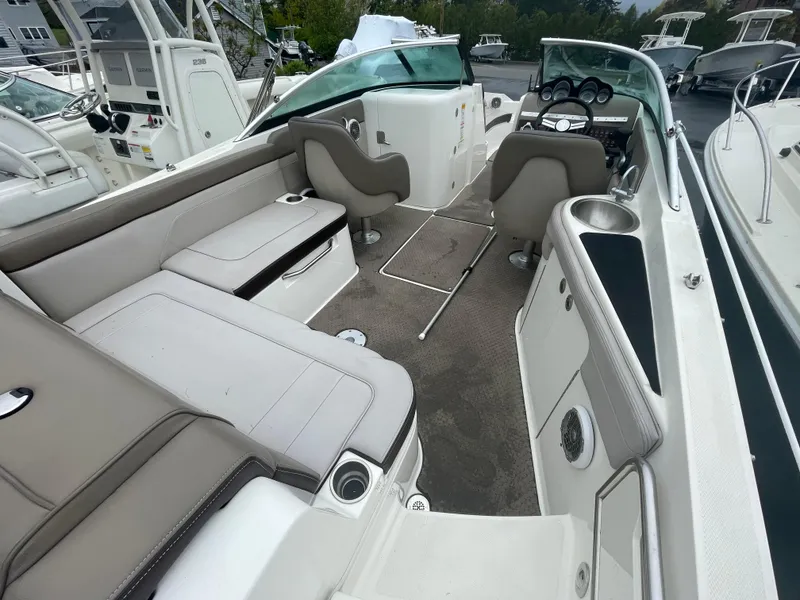 Slide: The Image of 2012 Sea Ray 260 Sundeck interior with spacious seating and modern dashboard. - 6