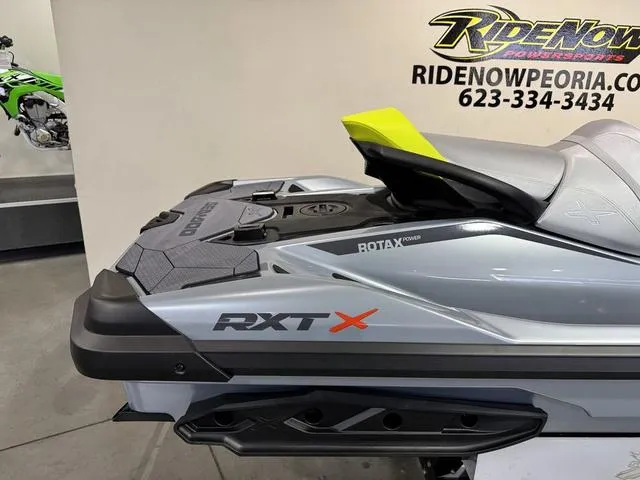 Slide: The Image of 2025 Sea-Doo Waverunner RXT-X, sleek design, displayed at RideNow dealership. - 13
