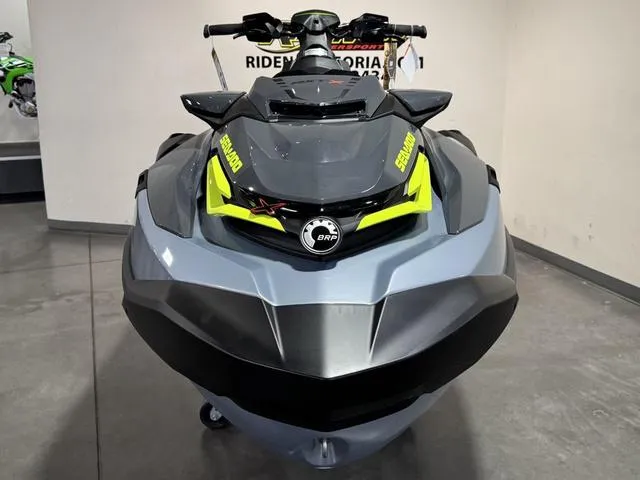 Slide: The Image of 2025 Sea-Doo Waverunner RXT-X in showroom, front view, sleek design, gray and yellow accents. - 3
