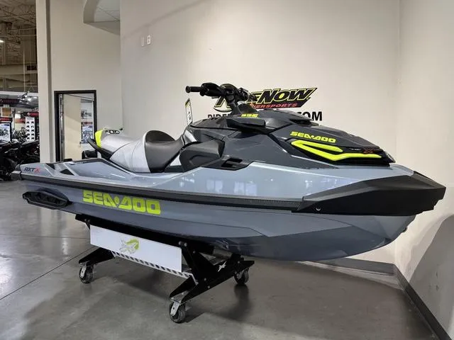 Slide: The Image of 2025 Sea-Doo RXT-X Waverunner displayed indoors on a stand. - 5