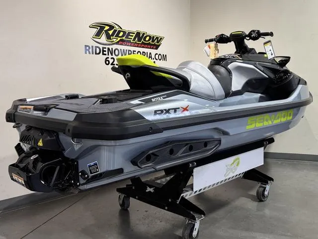Slide: The Image of 2025 Sea-Doo Waverunner RXT-X on display at RideNow Powersports showroom. - 6
