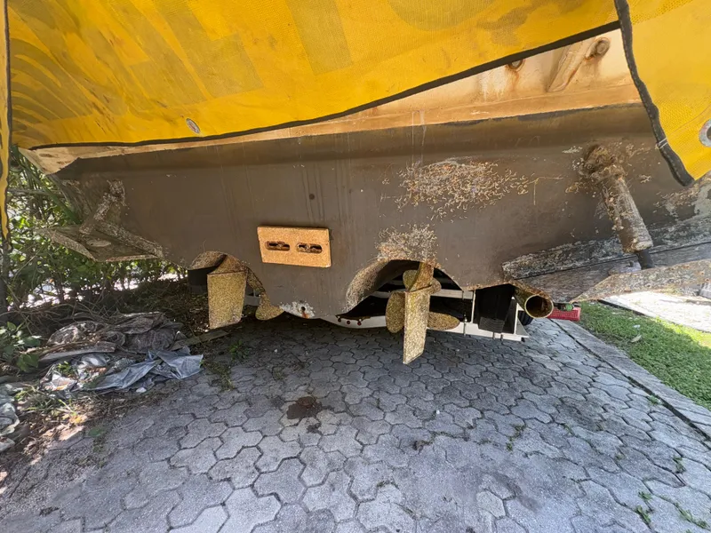 Slide: The Image of 1996 Sea Ray Sundancer 350 boat hull with visible propellers and marine growth. - 22