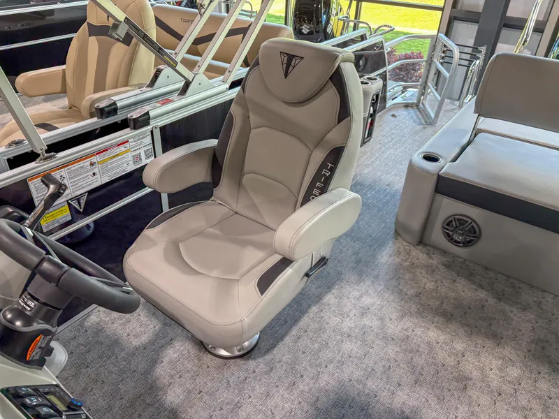 Slide: The Image of Captain's chair in 2025 Trifecta 24 UL LE pontoon boat interior. - 6