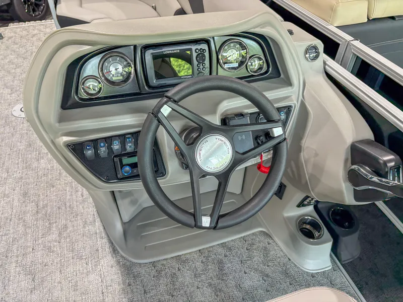 Slide: The Image of 2025 Trifecta 24 UL LE boat dashboard with steering wheel and control panel. - 7