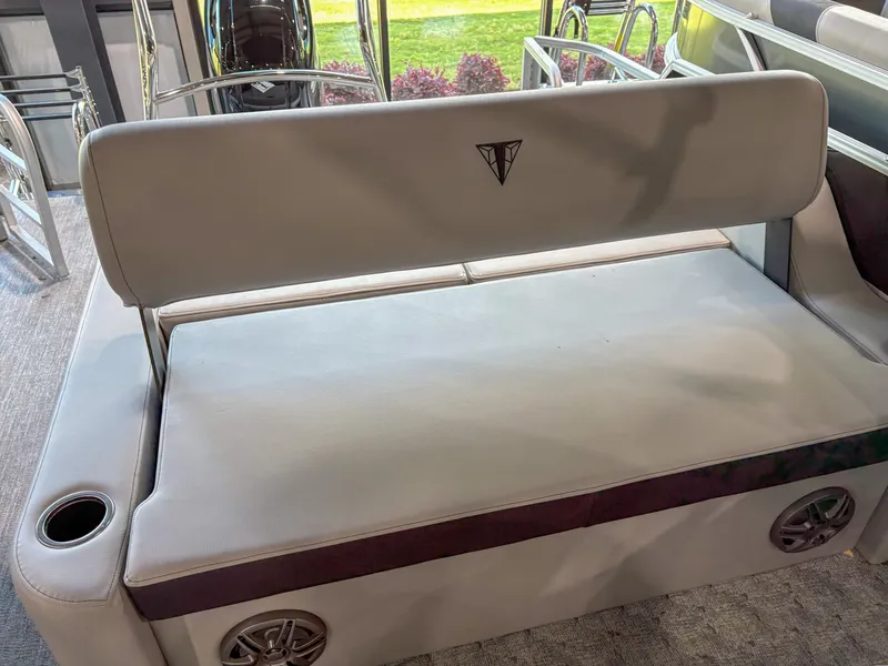 Slide: The Image of 2025 Trifecta 24 UL LE boat seat with cup holder and speaker. - 9