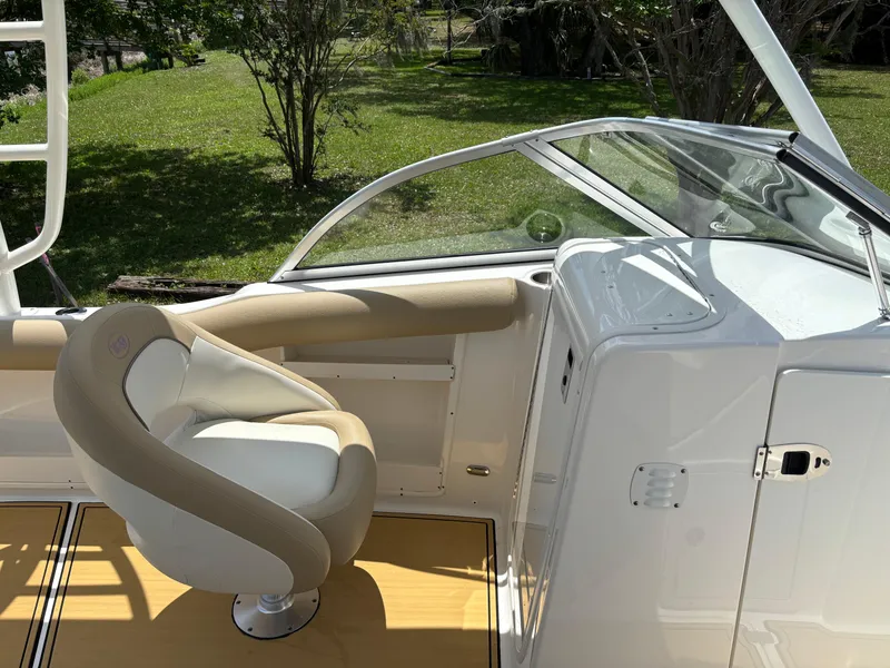 Slide: The Image of 2019 Key West 239 DFS boat interior with beige seating and sleek design. - 5