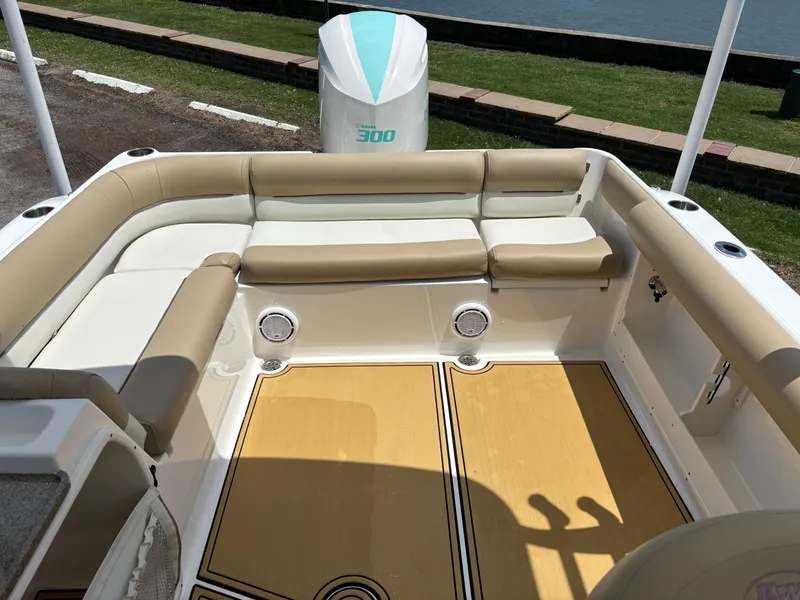 Slide: The Image of 2019 Key West 239 DFS boat interior with beige seating and Yamaha 300 engine. - 7