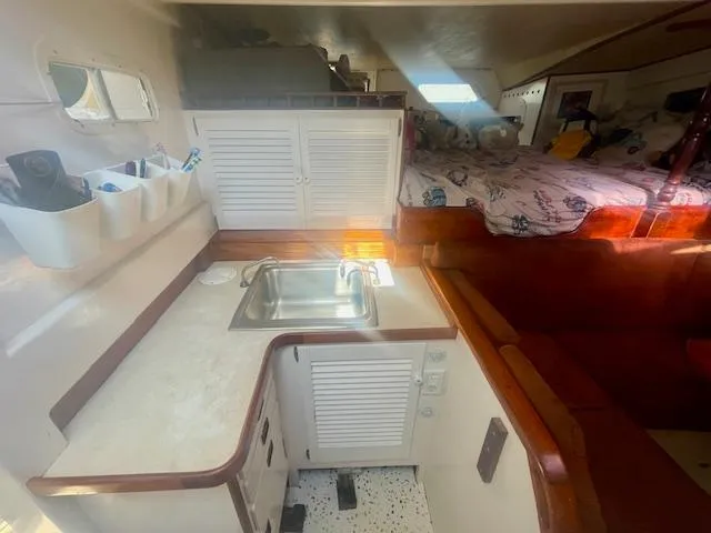 Slide: The Image of Interior of 1980 Custom Horstman Tristar Ketch with kitchenette and cozy sleeping area. - 10