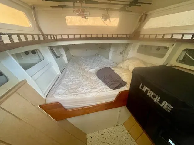 Slide: The Image of Cozy cabin interior of 1980 Custom Horstman Tristar Ketch with bed and storage. - 11