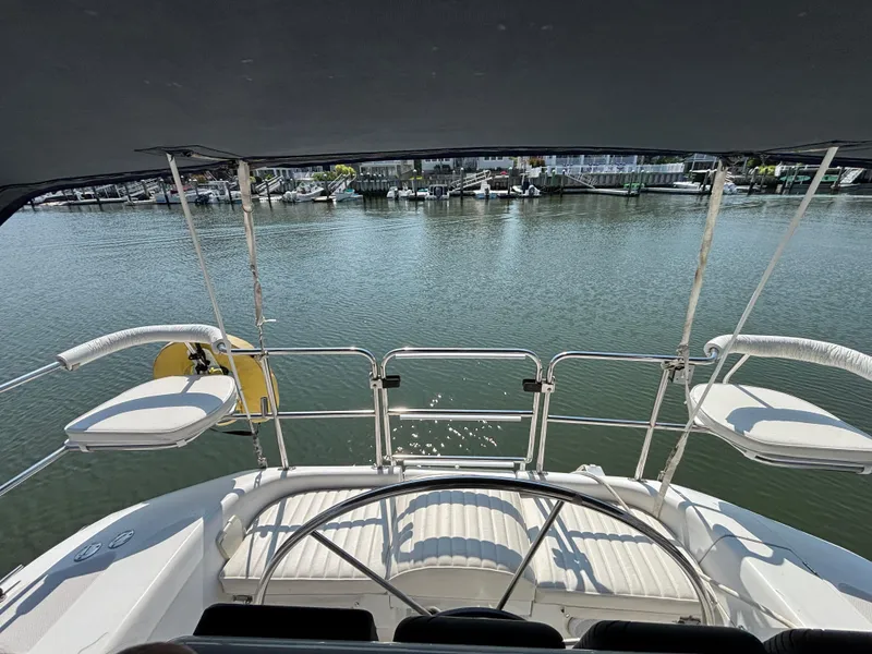 Slide: The Image of Sailboat cockpit view, Catalina 320, 1998, overlooking marina waters. - 15