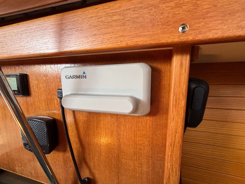 Slide: The Image of Garmin device mounted on 1998 Catalina 320 yacht's wooden interior panel. - 31
