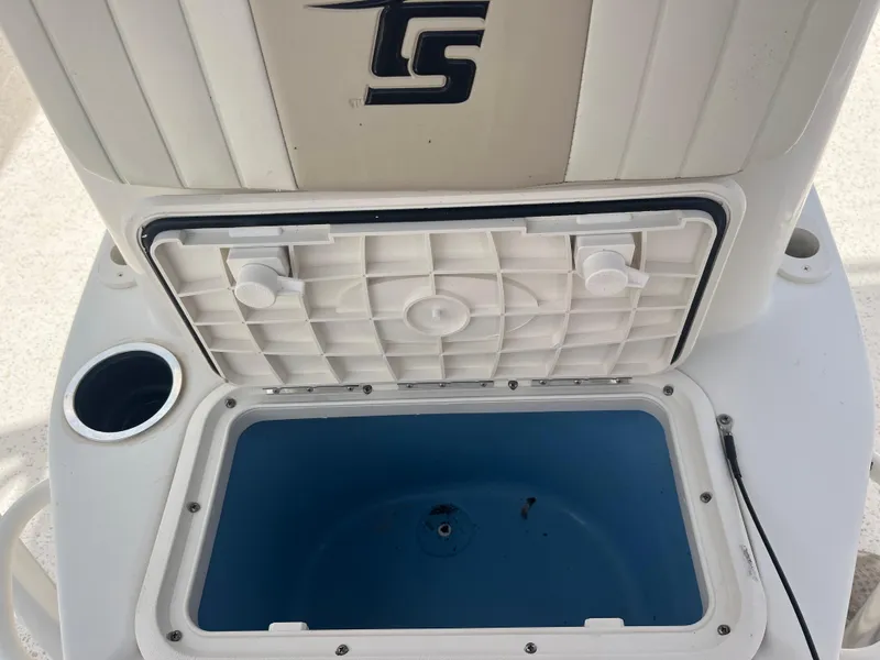 Slide: The Image of Open storage compartment on a 2019 Carolina Skiff 238 DLV boat. - 10