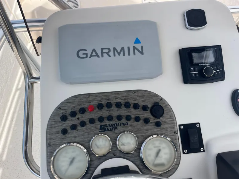 Slide: The Image of Control panel of a 2019 Carolina Skiff 238 DLV with Garmin navigation system. - 11