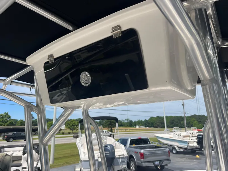 Slide: The Image of 2019 Carolina Skiff 238 DLV boat console with storage compartment and stainless steel frame. - 15