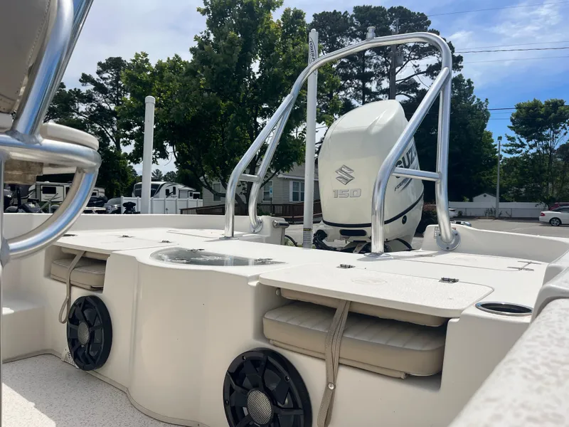 Slide: The Image of 2019 Carolina Skiff 238 DLV boat with Suzuki engine, outdoor setting. - 17