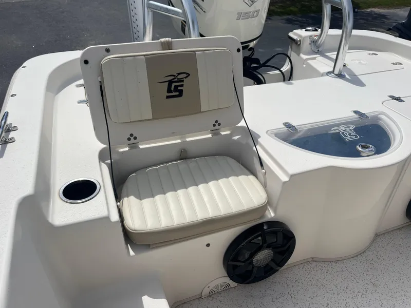 Slide: The Image of 2019 Carolina Skiff 238 DLV boat interior with seating and storage compartments. - 19