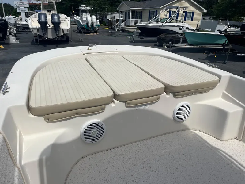 Slide: The Image of 2019 Carolina Skiff 238 DLV boat with cushioned seating and speakers on deck. - 7