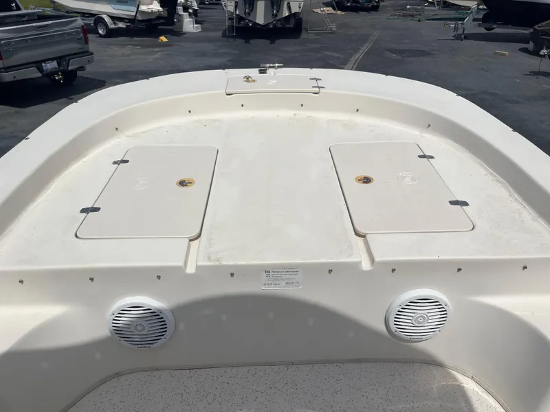 Slide: The Image of 2019 Carolina Skiff 238 DLV boat deck with storage compartments and speakers. - 8