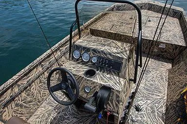 Slide: The Image of 2025 Crestliner 1860 Retriever CC Tunnel boat with camouflage design and seating. - 15