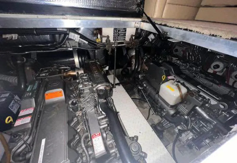 Slide: The Image of Engine room of 2003 Cruisers Yachts 3750 Motoryacht, showcasing dual engines and mechanical components. - 12