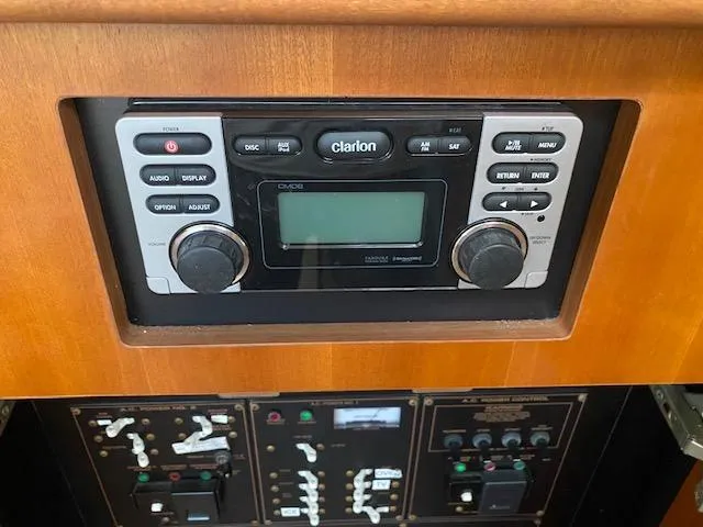 Slide: The Image of Control panel of 2003 Cruisers Yachts 3750 Motoryacht with Clarion audio system. - 31