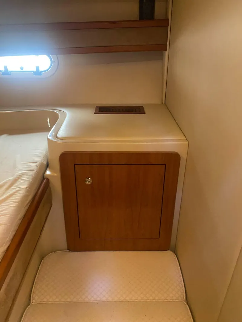 Slide: The Image of 2003 Cruisers Yachts 3750 Motoryacht interior with wooden cabinet and bed. - 48