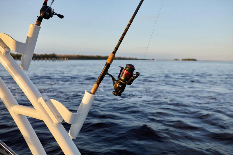 Slide: The Image of Fishing rod on Finseeker 240 DC boat, 2026 model, with ocean view. - 10