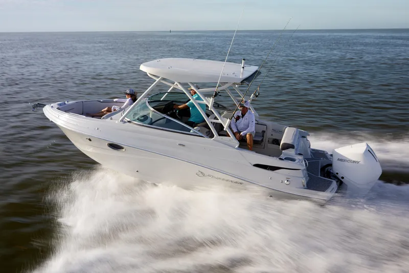 Slide: The Image of 2026 Finseeker 240 DC boat cruising on open water with passengers onboard. - 13