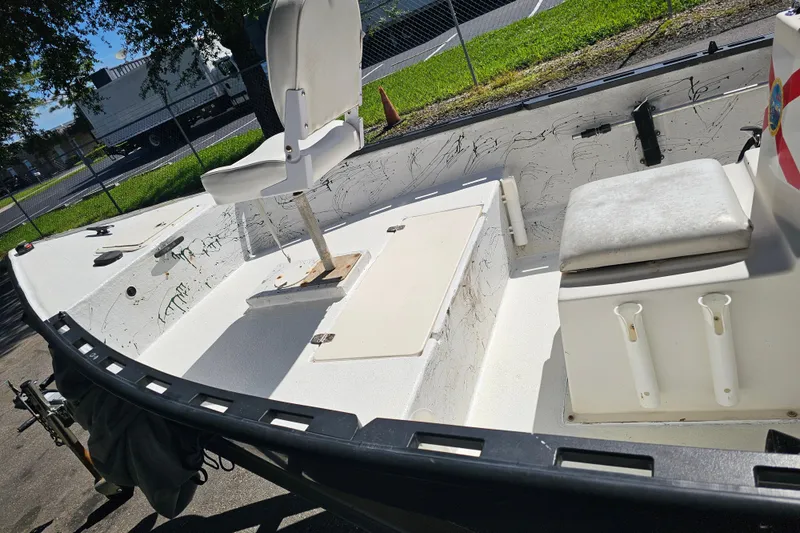 Slide: The Image of 1999 Aqua Force Fish Hawk boat interior with seating and storage compartments. - 5