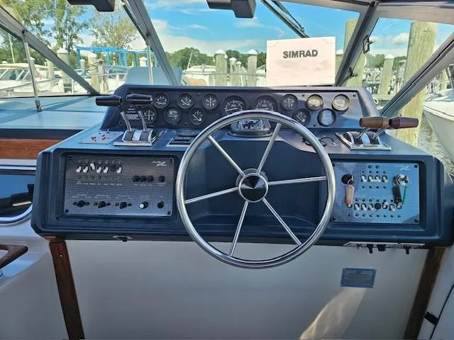 Slide: The Image of Helm of 1988 Sea Ray 340 Sundancer with steering wheel and control panels. - 14