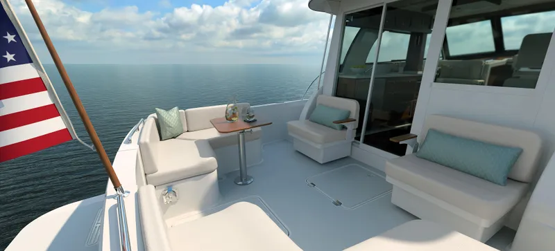 Slide: The Image of Back Cove 412 yacht deck with seating, table, and ocean view, 2026 model. - 6