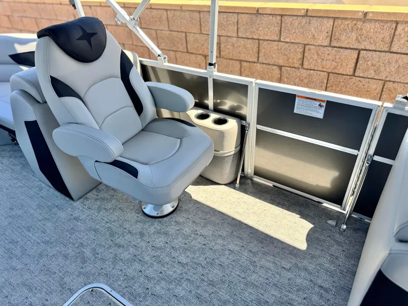 Slide: The Image of Luxurious seating on 2025 Berkshire 22RFX LE pontoon boat with cup holders. - 13