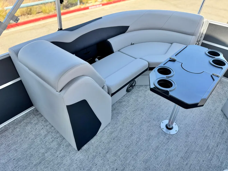 Slide: The Image of Luxurious seating area on 2025 Berkshire 22RFX LE pontoon boat with cupholders. - 17