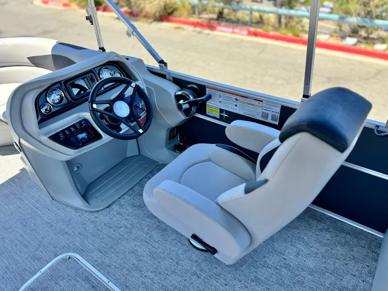 Slide: The Image of 2025 Berkshire 22RFX LE boat interior with steering wheel and captain's chair. - 20