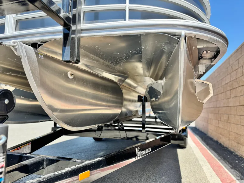 Slide: The Image of 2025 Berkshire 22RFX LE pontoon boat on trailer, close-up of pontoons. - 3
