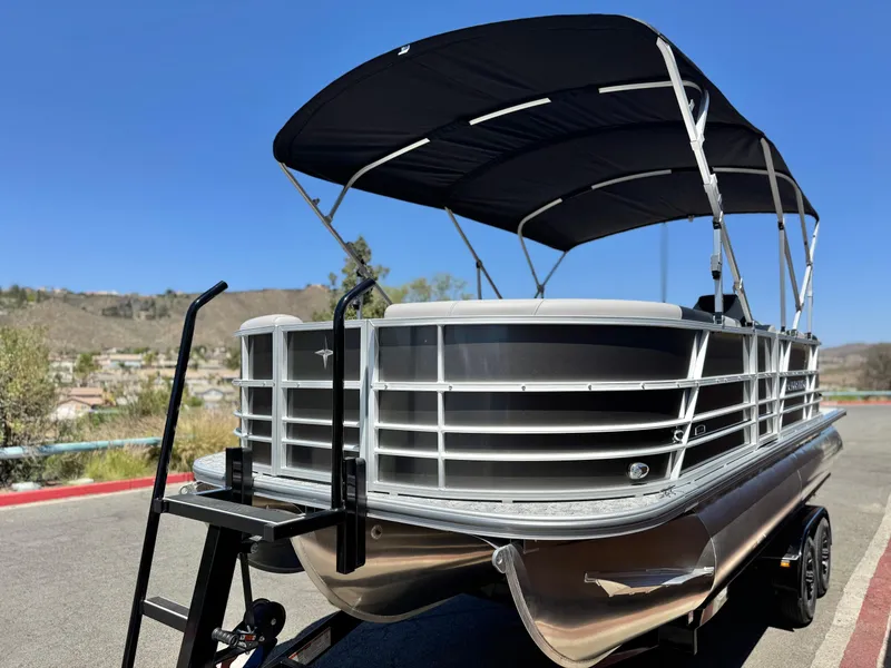 Slide: The Image of 2025 Berkshire 22RFX LE pontoon boat with canopy on a trailer. - 4