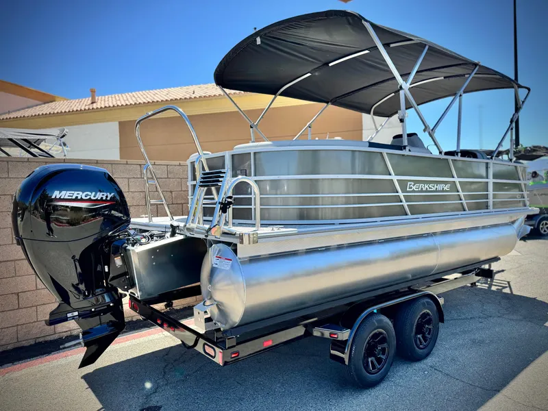 Slide: The Image of 2025 Berkshire 22RFX LE pontoon boat with Mercury engine on trailer. - 6
