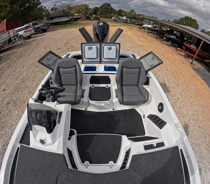 Slide: The Image of 2025 iKon VLE21 boat interior with dual seats and storage compartments. - 2