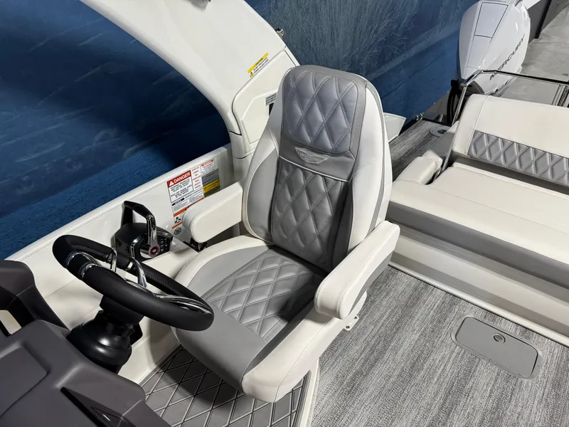 Slide: The Image of Luxurious interior of 2026 Bennington 27 RXSBAT2 boat with plush seating and modern controls. - 12