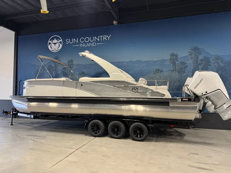 Slide: The Image of 2026 Bennington 27 RXSBAT2 pontoon boat on trailer at Sun Country Inland showroom. - 4