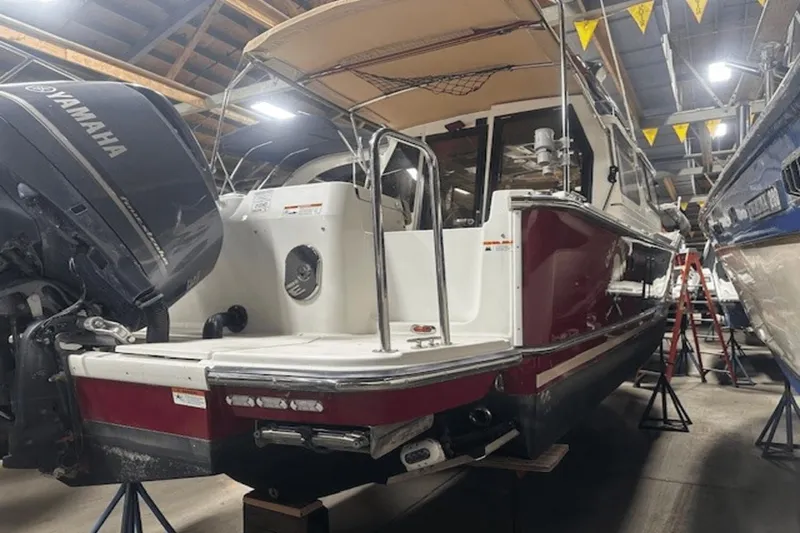 Slide: The Image of 2019 Ranger R27 LE boat with Yamaha engine in a storage facility. - 0