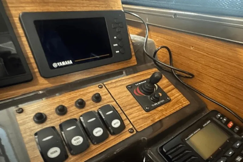 Slide: The Image of Control panel of 2019 Ranger R27 LE boat with Yamaha display and thruster joystick. - 19