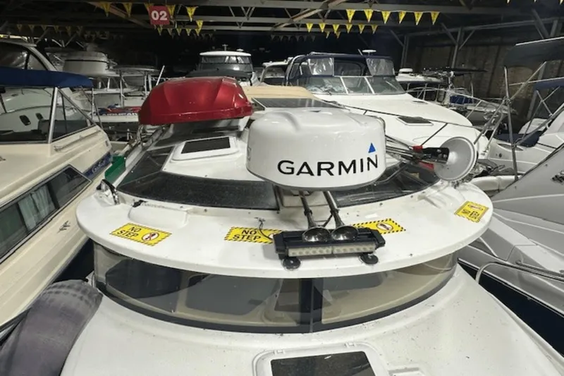 Slide: The Image of 2019 Ranger R27 LE boat with Garmin equipment in a storage facility. - 30