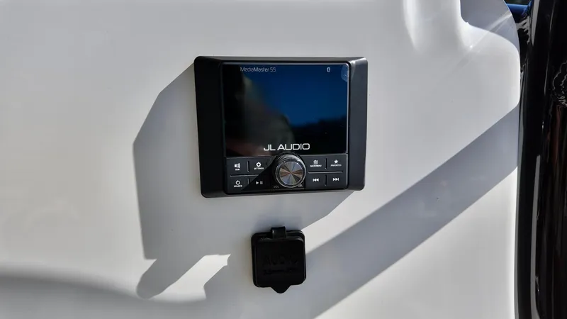 Slide: The Image of JL Audio system on 2025 Pioneer 222 Islander boat dashboard. - 10